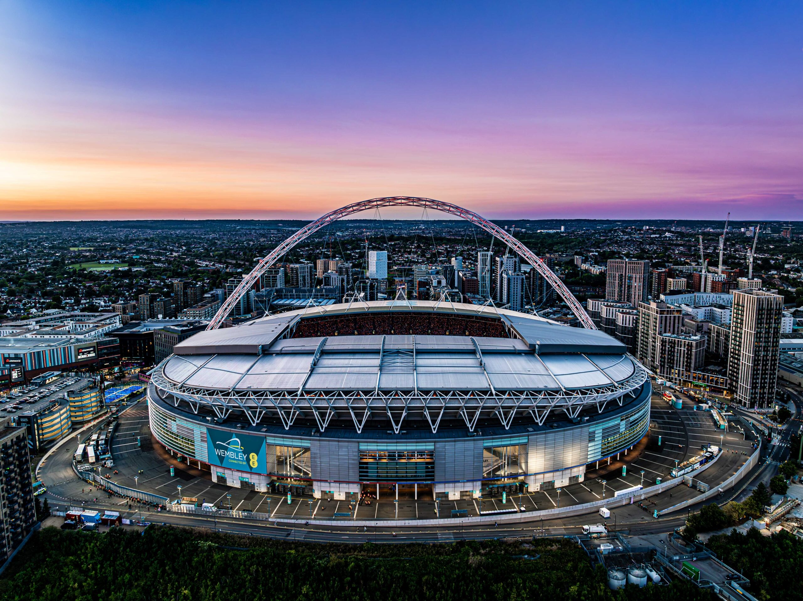 Wembley stadium by night with sunset